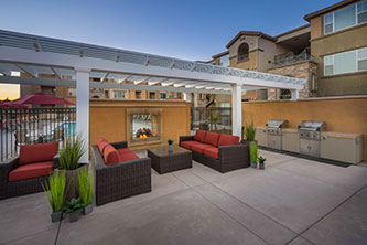 Common area fireplace, seating and pool at The Landing, Sacramento